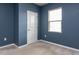 Bedroom features a window, neutral carpet and paint, and white door and trim at 3521 Strawberry Patch Row, Raleigh, NC 27604