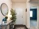 Welcoming entryway with console table, mirror, and view into adjacent room at 3521 Strawberry Patch Row, Raleigh, NC 27604