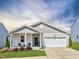 Charming single-story home featuring a welcoming front porch, attached garage, and well-maintained landscaping at 3521 Strawberry Patch Row, Raleigh, NC 27604