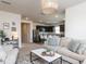 Cozy living room with stylish furniture and decor open to an eat-in kitchen with stainless steel appliances at 3521 Strawberry Patch Row, Raleigh, NC 27604