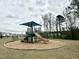 Community playground with modern equipment, perfect for Gathering fun at 3521 Strawberry Patch Row, Raleigh, NC 27604