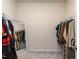 Spacious walk-in closet featuring ample hanging storage and a full-length mirror at 3521 Strawberry Patch Row, Raleigh, NC 27604