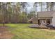 Expansive backyard featuring a spacious deck and bordered by mature trees providing serene privacy at 3881 Whisperwood Ct, Youngsville, NC 27596