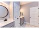 Bathroom features double vanity sinks, modern mirrors, and stylish fixtures at 3881 Whisperwood Ct, Youngsville, NC 27596