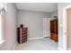 Light-filled bedroom with neutral walls and trim, featuring a dresser and cabinet at 3881 Whisperwood Ct, Youngsville, NC 27596