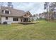Beautiful home exterior with a spacious backyard and deck, perfect for outdoor entertaining and relaxation at 3881 Whisperwood Ct, Youngsville, NC 27596