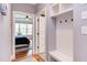 Mudroom with built-in storage, bench, and view into the bedroom at 3881 Whisperwood Ct, Youngsville, NC 27596