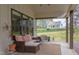 Welcoming front porch features a cozy seating area with plush cushions, perfect for relaxing and enjoying the outdoors at 3881 Whisperwood Ct, Youngsville, NC 27596