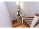 Open staircase boasts wood treads, sleek black metal railings, and white risers at 3881 Whisperwood Ct, Youngsville, NC 27596