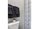 Bathroom includes decorative towels with patterned shower curtain and a modern, minimalist design at 4015 Jasper Olive Rd # 30, Apex, NC 27523