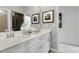 Bright bathroom featuring a double vanity with white countertops and chrome fixtures, completed with stylish decorations at 4015 Jasper Olive Rd # 30, Apex, NC 27523