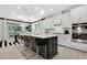 Modern kitchen with white cabinets, island, and barstool seating at 4015 Jasper Olive Rd # 30, Apex, NC 27523