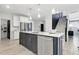 Kitchen island with stainless steel dishwasher and view to stairs at 4015 Jasper Olive Rd # 30, Apex, NC 27523
