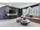 Stylish living area with a workstation, leather sofa, and ample natural light at 4015 Jasper Olive Rd # 30, Apex, NC 27523