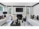 Bright living room with a fireplace and a modern design and many windows at 4015 Jasper Olive Rd # 30, Apex, NC 27523