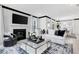 Stylish living room with a fireplace, sofa, and decorative rug at 4015 Jasper Olive Rd # 30, Apex, NC 27523