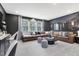 Cozy living room featuring a leather sectional, natural light, and stylish decor at 4015 Jasper Olive Rd # 30, Apex, NC 27523