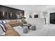 Well-decorated living room with a leather sofa, decorative prints, and modern accents at 4015 Jasper Olive Rd # 30, Apex, NC 27523