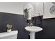 Elegant powder room with a pedestal sink and decorative mirror at 4015 Jasper Olive Rd # 30, Apex, NC 27523