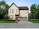 Rendering of modern two-story home featuring an attached garage, stylish lighting, and landscaped front yard at 406 Columbia Dr, Raleigh, NC 27604