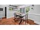 Cozy dining area with natural light, hardwood floors, and stylish floating shelves for decor at 4769 Swordfish Dr, Raleigh, NC 27603