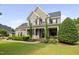 Stately home with a covered porch, well-maintained lawn, and inviting curb appeal at 4769 Swordfish Dr, Raleigh, NC 27603