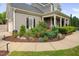 Beautiful home featuring a covered porch, manicured landscaping, and classic design at 4769 Swordfish Dr, Raleigh, NC 27603