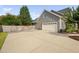 Exterior view showing driveway, garage and well-maintained landscaping at 4769 Swordfish Dr, Raleigh, NC 27603