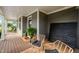 Charming front porch featuring a cozy seating arrangement and stylish decor at 4769 Swordfish Dr, Raleigh, NC 27603