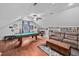 Finished attic boasts a game room with a pool table, seating, and unique decor at 4769 Swordfish Dr, Raleigh, NC 27603