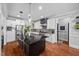 Spacious kitchen with a center island, stainless steel appliances, granite countertops, and white cabinetry at 4769 Swordfish Dr, Raleigh, NC 27603
