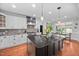 Bright kitchen with a large center island, stainless steel appliances, and modern pendant lighting at 4769 Swordfish Dr, Raleigh, NC 27603