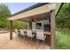 Inviting outdoor bar area with seating, a television, fan and storage at 4769 Swordfish Dr, Raleigh, NC 27603
