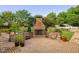 Cozy outdoor fireplace and patio, perfect for entertaining guests in a landscaped backyard at 4769 Swordfish Dr, Raleigh, NC 27603