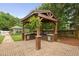 Outdoor kitchen grill station with bar, brick patio, and manicured backyard at 4769 Swordfish Dr, Raleigh, NC 27603