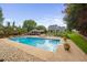 Beautiful backyard featuring a large swimming pool, lounge chairs, and a bar area at 4769 Swordfish Dr, Raleigh, NC 27603