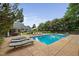 Backyard swimming pool, lounge chairs, and bar area in a lush, green setting at 4769 Swordfish Dr, Raleigh, NC 27603