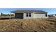 Backyard features a covered patio and is surrounded by a grassy lawn at 48 Pate Landing Dr, Selma, NC 27576