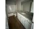 Bathroom features a granite-topped vanity, toilet, and shower-tub combo at 48 Pate Landing Dr, Selma, NC 27576