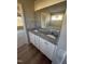 Bathroom featuring a double sink vanity with granite countertops and white cabinets at 48 Pate Landing Dr, Selma, NC 27576