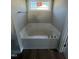 Bright bathroom features a large soaking bathtub with a window at 48 Pate Landing Dr, Selma, NC 27576