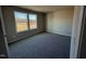Bedroom with neutral walls and carpeting, brightened by large windows at 48 Pate Landing Dr, Selma, NC 27576