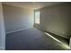 Bedroom featuring neutral walls and carpeting, with a bright window at 48 Pate Landing Dr, Selma, NC 27576