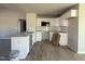 Modern kitchen boasts white cabinets, granite countertops, stainless steel appliances, and a functional island at 48 Pate Landing Dr, Selma, NC 27576