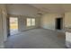 Bright living room featuring vaulted ceilings, neutral carpeting, and large windows, creating an airy atmosphere at 48 Pate Landing Dr, Selma, NC 27576