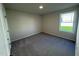 Carpeted bedroom with a window, neutral paint and a closet at 49 Heatherglenn Cir, Princeton, NC 27569