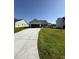 Charming one story home featuring a two-car garage, manicured lawn, and inviting front porch at 49 Heatherglenn Cir, Princeton, NC 27569