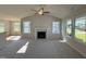 Bright living room featuring a fireplace, vaulted ceilings, and multiple windows providing ample natural light at 49 Heatherglenn Cir, Princeton, NC 27569
