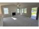 Bright living room featuring a fireplace, vaulted ceilings, and multiple windows providing ample natural light at 49 Heatherglenn Cir, Princeton, NC 27569