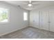Comfortable bedroom featuring plush carpeting, ample closet space, and natural light at 4912 Sunset Forest Cir, Holly Springs, NC 27540